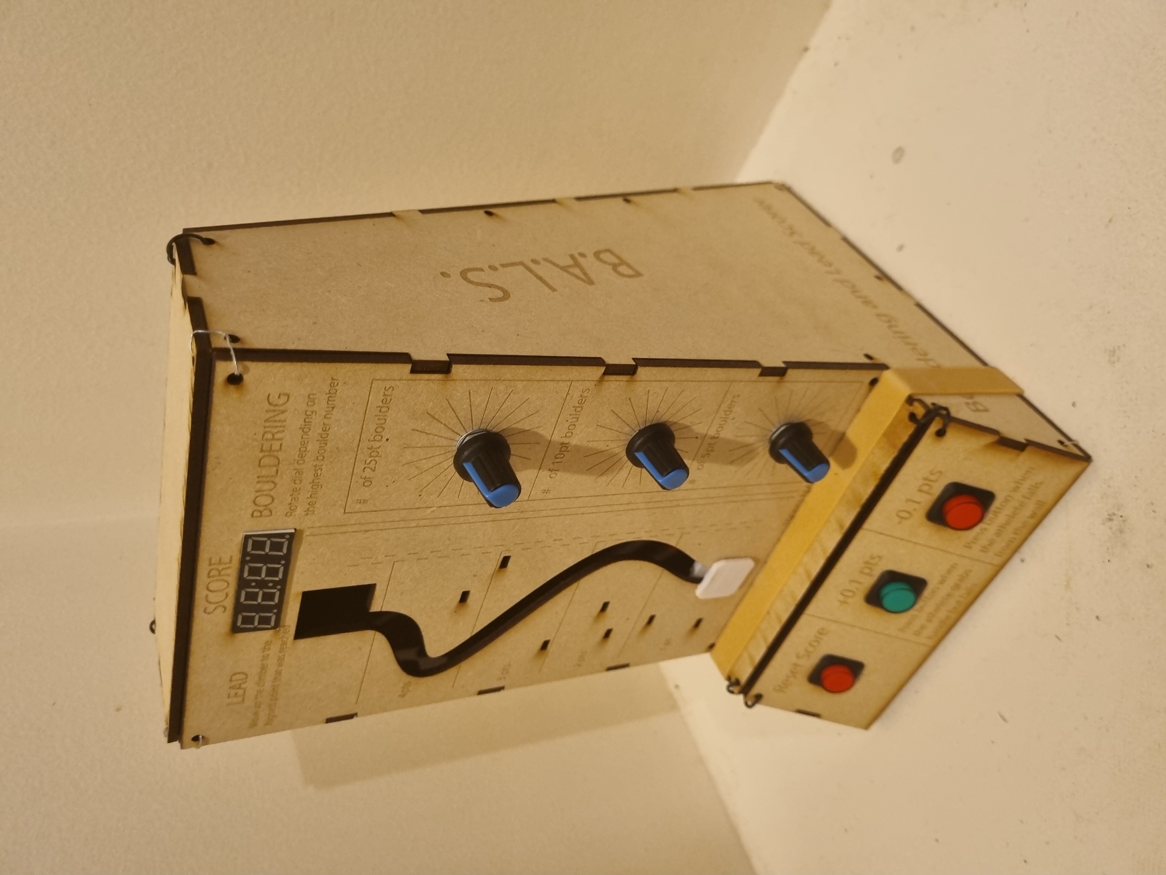 Photo of the B.A.L.S second iteration prototype with improvements from the first that involve the printed materials now fitting correctly and an additional pathway to move a slider.